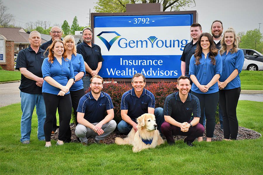 Wealth Advisors Portrait of the Gem Young Insurance Wealth Advisors Team Outside in Front of Office Sign May 2021